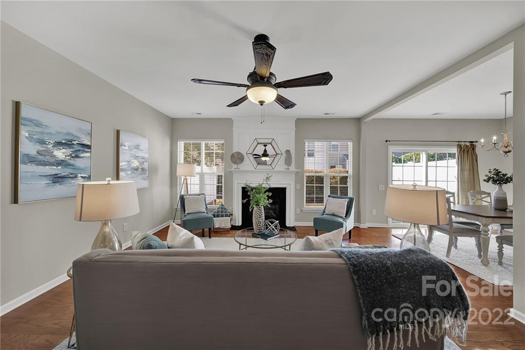 9168 Redmond Trace Road Charlotte, NC 28277 - Photo 5 of 24 a living room with fireplace furniture and a chandelier