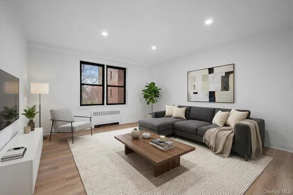 a living room with furniture rug and window