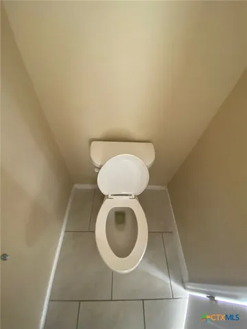 a bathroom with a toilet and a sink