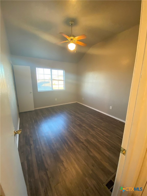 4002 Doraine Court, Unit A Killeen, TX 76549 - Photo 5 of 18 wooden floor in an empty room with a window
