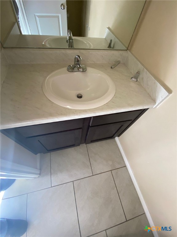 4002 Doraine Court, Unit A Killeen, TX 76549 - Photo 9 of 18 a bathroom with a sink and a mirror