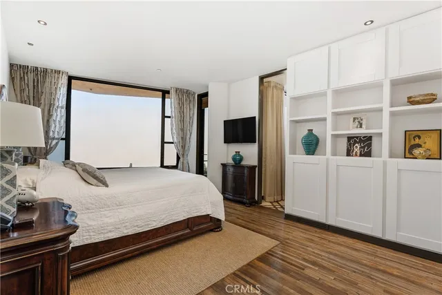 a view of a patio with couches table and chairs and potted plants