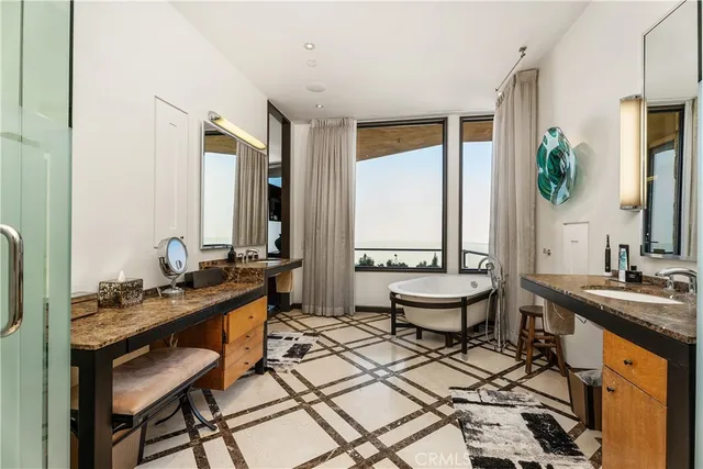 a bathroom with a sink a washer and dryer