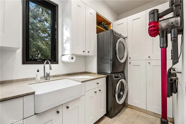 a bedroom with a large bed and a flat tv screen on dresser