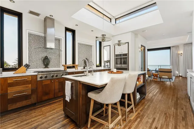 a view of a patio with table and chairs under an umbrella