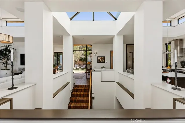 a dining room with furniture and a floor to ceiling window