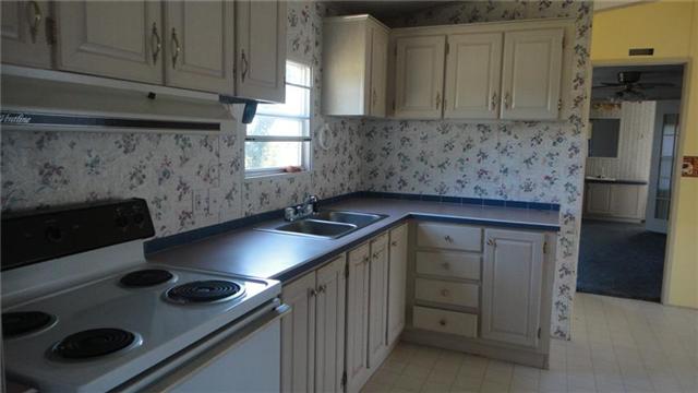 7122 Buncombe Road Belvidere, TN 37306 - Photo 5 of 15 Kitchen features a windowed sink, lots of counter and cabinet space, and a nearby eating area.