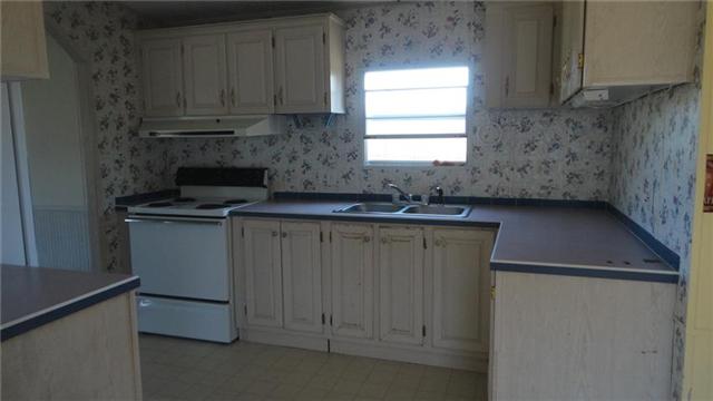 7122 Buncombe Road Belvidere, TN 37306 - Photo 7 of 15 Kitchen earns points for efficiency and functionality with three pivot points to help facilitate meal preparation.