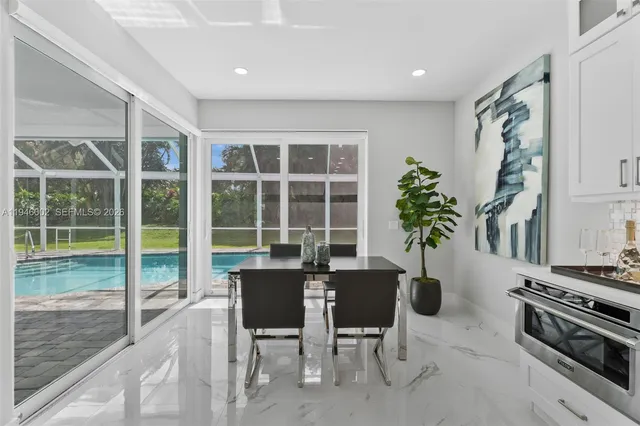 a view of a dining room with furniture window and outside view