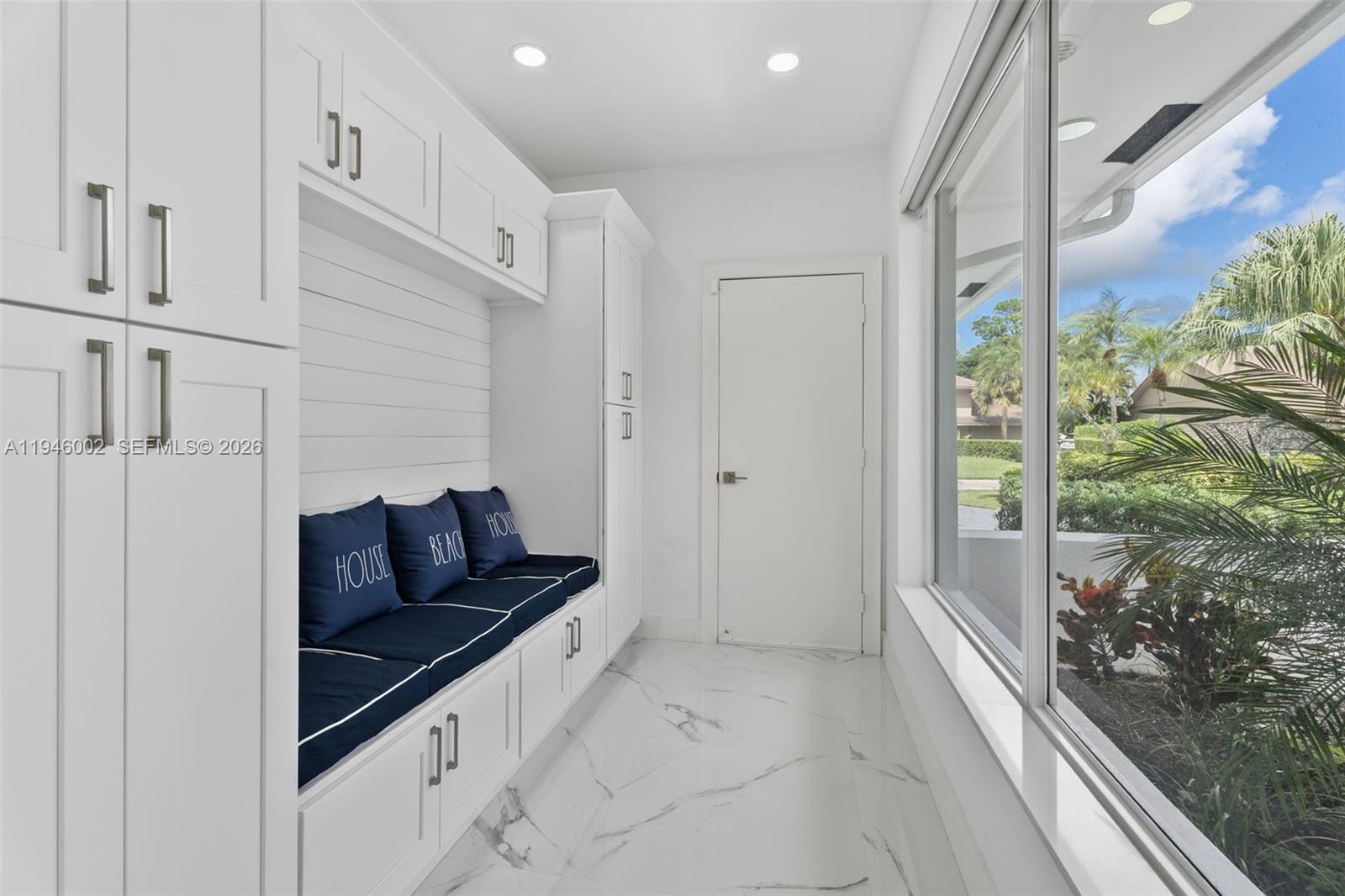 17 Surrey Road Palm Beach Gardens, FL 33418 - Photo 24 of 43 a living room with furniture and a gate