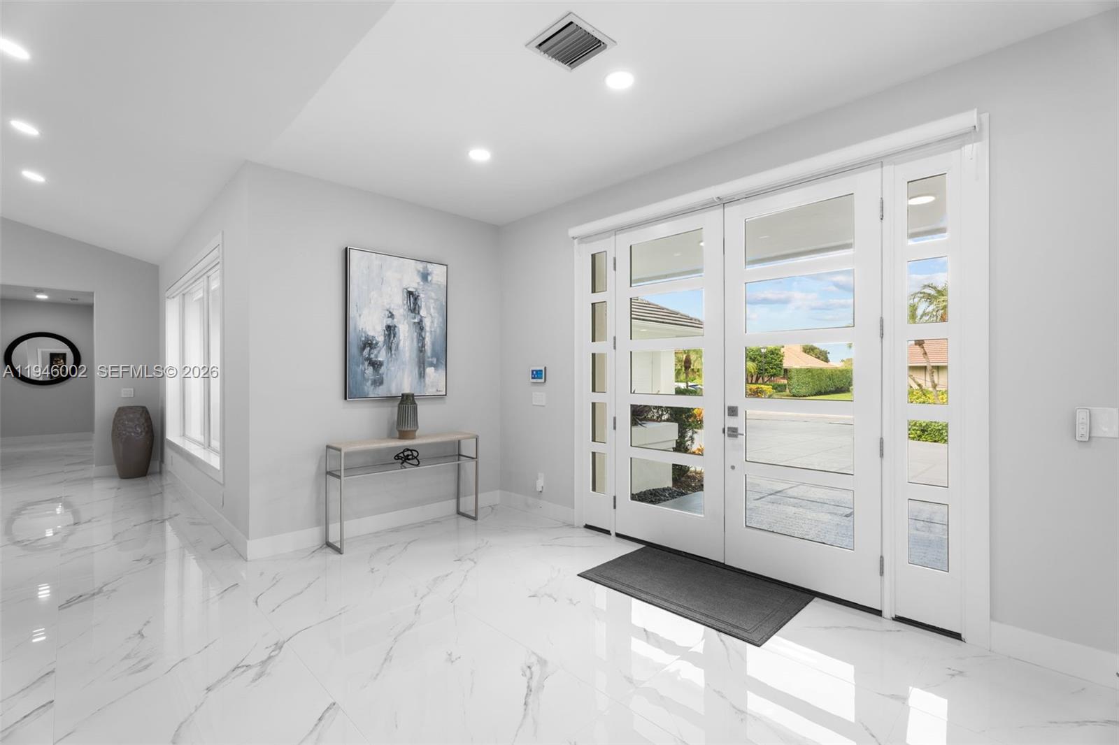 17 Surrey Road Palm Beach Gardens, FL 33418 - Photo 3 of 43 a bedroom with furniture and a window