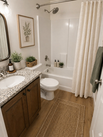 3831 South Powderwood Lane, Unit 111 Mapleton, UT 84664 - Photo 6 of 12 Full bathroom featuring a single vanity with stone-finish countertop, wood-finish cabinetry, and an undermount sink