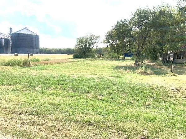 a view of a large yard with an outdoor space