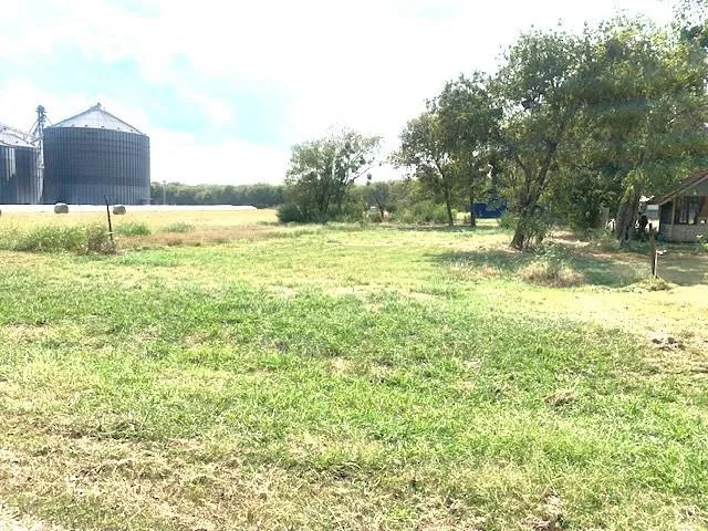 a view of a large yard with an outdoor space