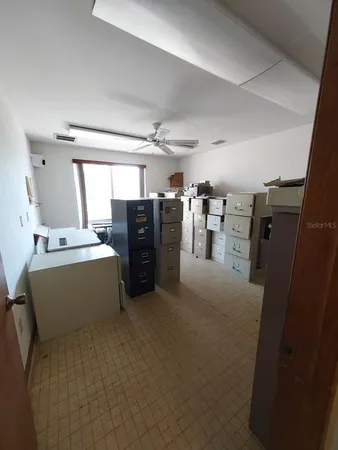 a view of an empty room with a window