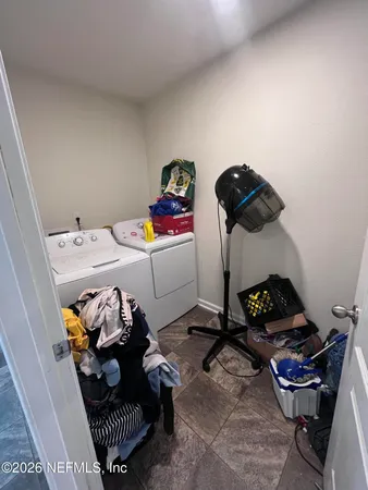 a bedroom with a bed and cabinets