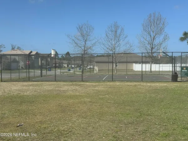 a view of outdoor space with deck and tree