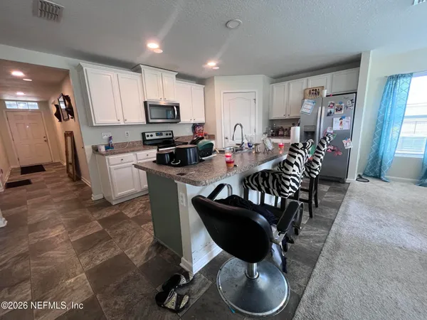 a view of a dining room with furniture
