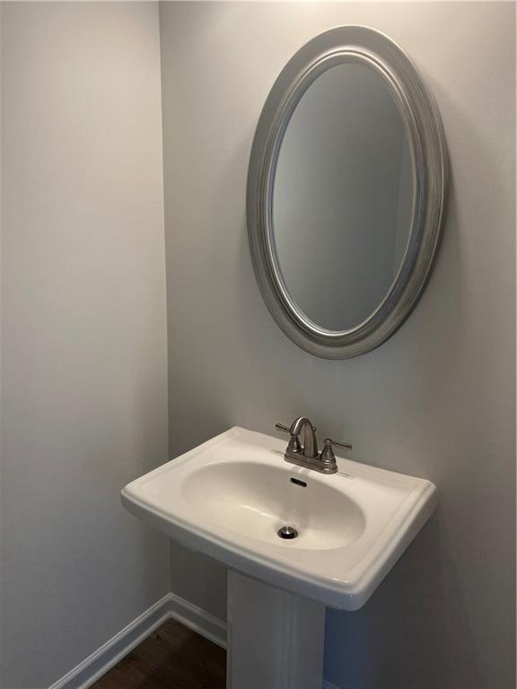 243 Witter Way Woodstock, GA 30188 - Photo 14 of 45 a bathroom with a sink and a mirror