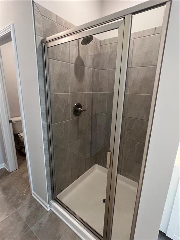 243 Witter Way Woodstock, GA 30188 - Photo 17 of 45 a bathroom with a shower