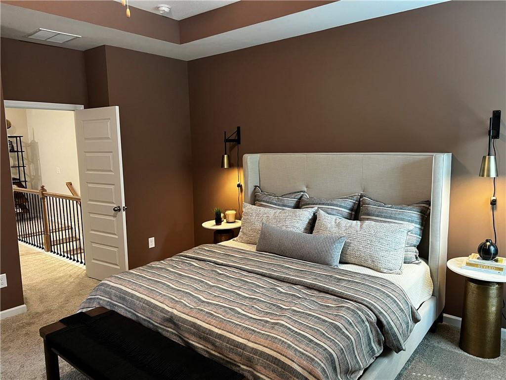 243 Witter Way Woodstock, GA 30188 - Photo 29 of 45 a bedroom with a bed and wooden floor