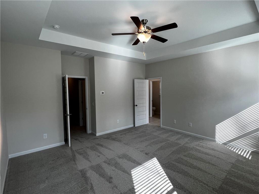 243 Witter Way Woodstock, GA 30188 - Photo 36 of 45 a view of an empty room with a ceiling fan