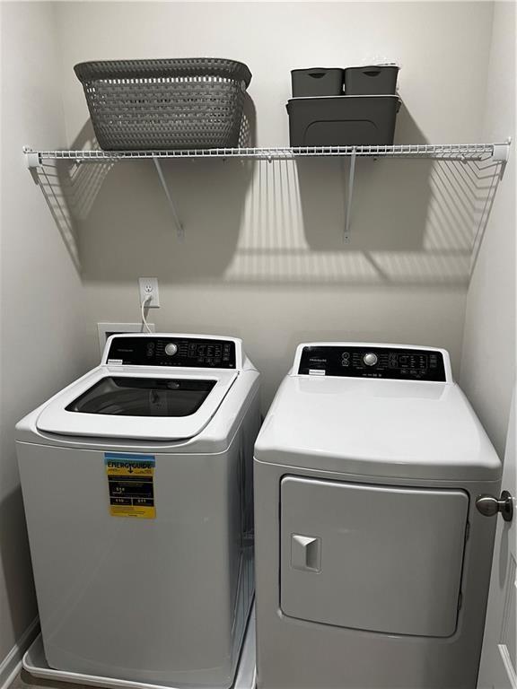 243 Witter Way Woodstock, GA 30188 - Photo 41 of 45 a utility room with dryer and washer