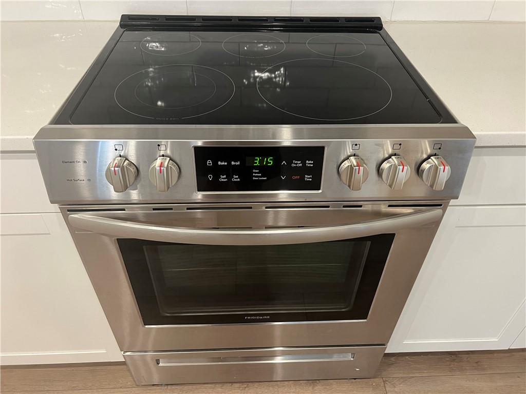 243 Witter Way Woodstock, GA 30188 - Photo 10 of 45 a close view of stove top oven