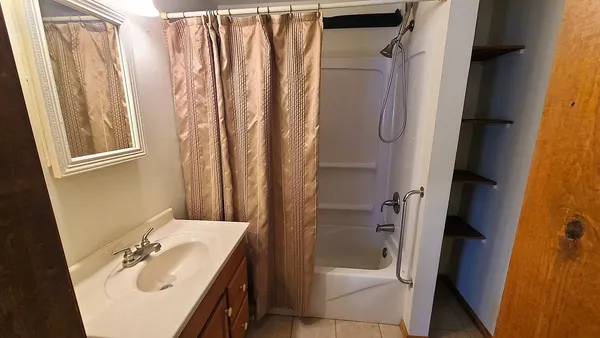a bathroom with a shower and toilet