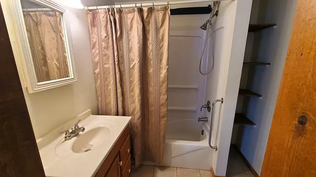 a bathroom with a shower and toilet