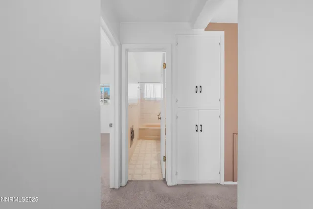 a bathroom with a bathtub a sink a vanity and a shower