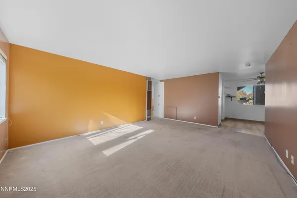 a kitchen with granite countertop a stove top oven sink and cabinets