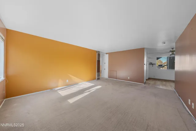 a kitchen with granite countertop a stove top oven sink and cabinets