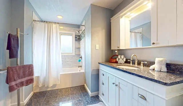 a bedroom with a bed and a television