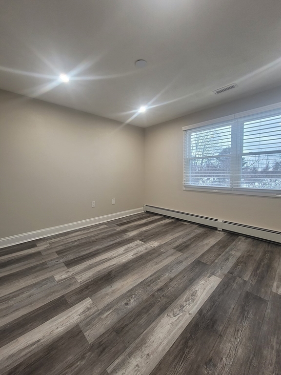 19 Saugus Avenue, Unit 2 Saugus, MA 01906 - Photo 9 of 13 a view of empty room with window and wooden floor