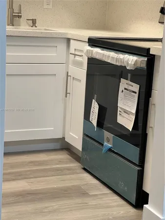 a kitchen with a sink and cabinets