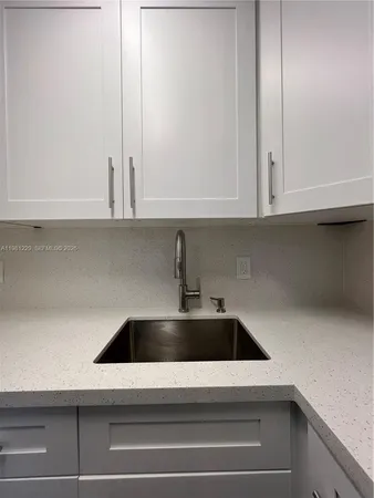 a view of a kitchen from the hallway