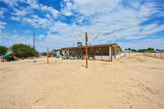 an aerial view of residential building and yard