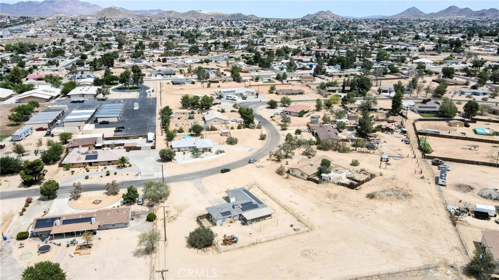 18251 Hiawatha Road Apple Valley, CA 92307 - Photo 23 of 58 an aerial view of residential houses with outdoor space