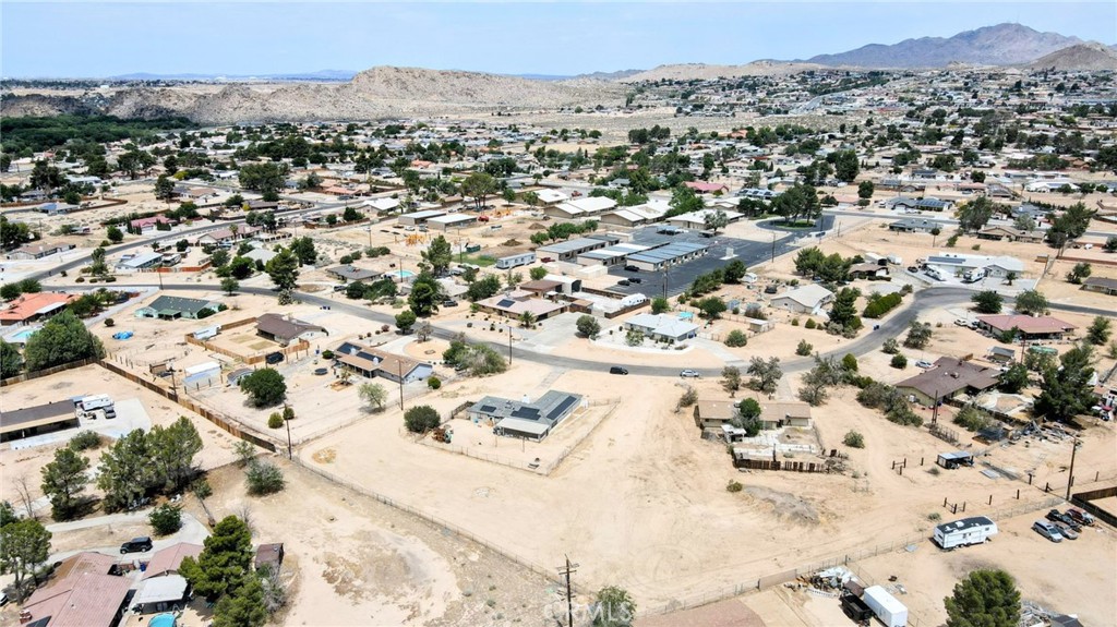 18251 Hiawatha Road Apple Valley, CA 92307 - Photo 32 of 58 an aerial view of residential houses with outdoor space