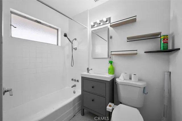 a kitchen with stainless steel appliances a sink stove and cabinets