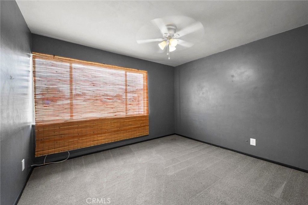 18251 Hiawatha Road Apple Valley, CA 92307 - Photo 45 of 58 an empty room with windows