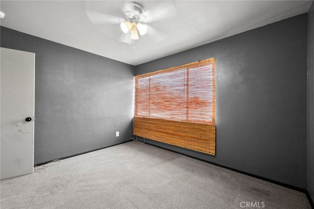 18251 Hiawatha Road Apple Valley, CA 92307 - Photo 46 of 58 a view of an empty room with a window