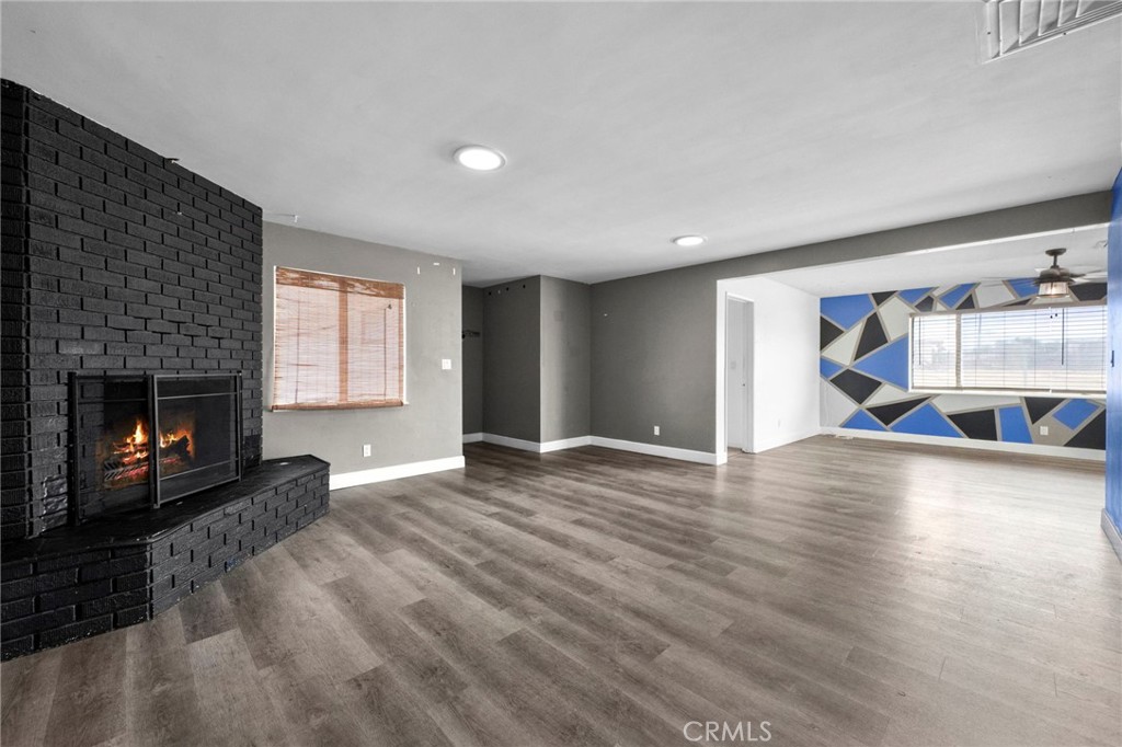 18251 Hiawatha Road Apple Valley, CA 92307 - Photo 52 of 58 a view of a living room a window and a fireplace