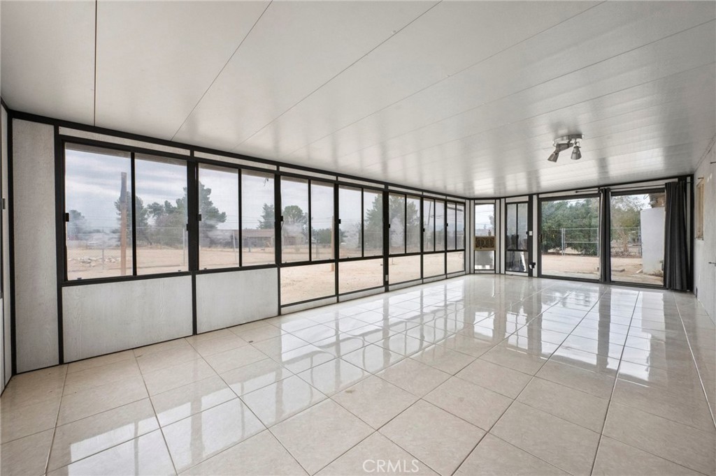 18251 Hiawatha Road Apple Valley, CA 92307 - Photo 56 of 58 a view of a big room with windows and chandelier