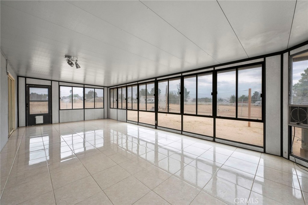 18251 Hiawatha Road Apple Valley, CA 92307 - Photo 58 of 58 a view of an empty room with a large window