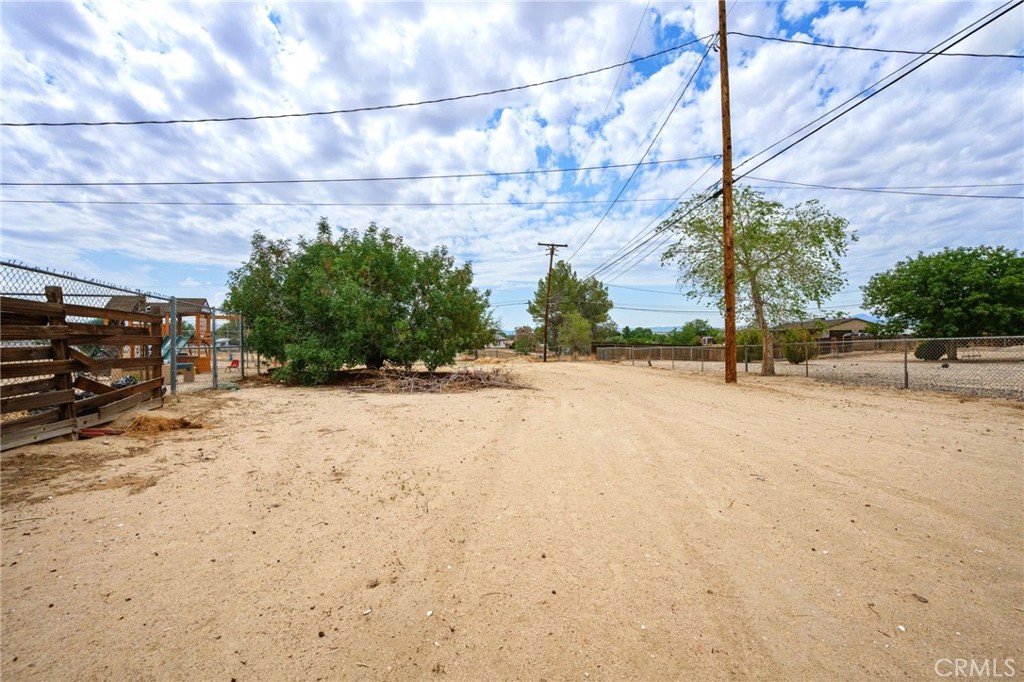 18251 Hiawatha Road Apple Valley, CA 92307 - Photo 8 of 58 a view of road with a building