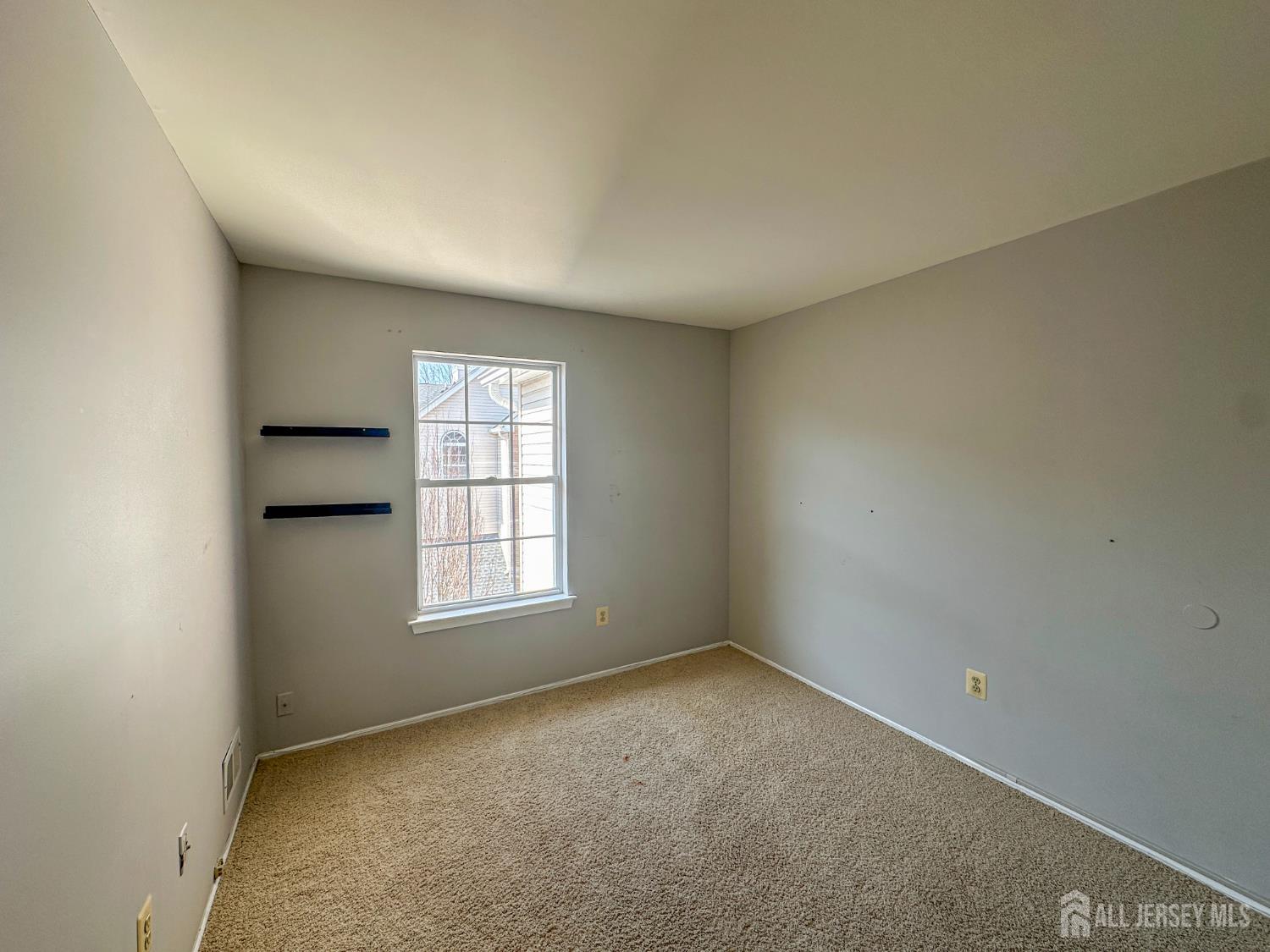 1212 Plymouth Road North Brunswick, NJ 08902 - Photo 13 of 27 an empty room with windows