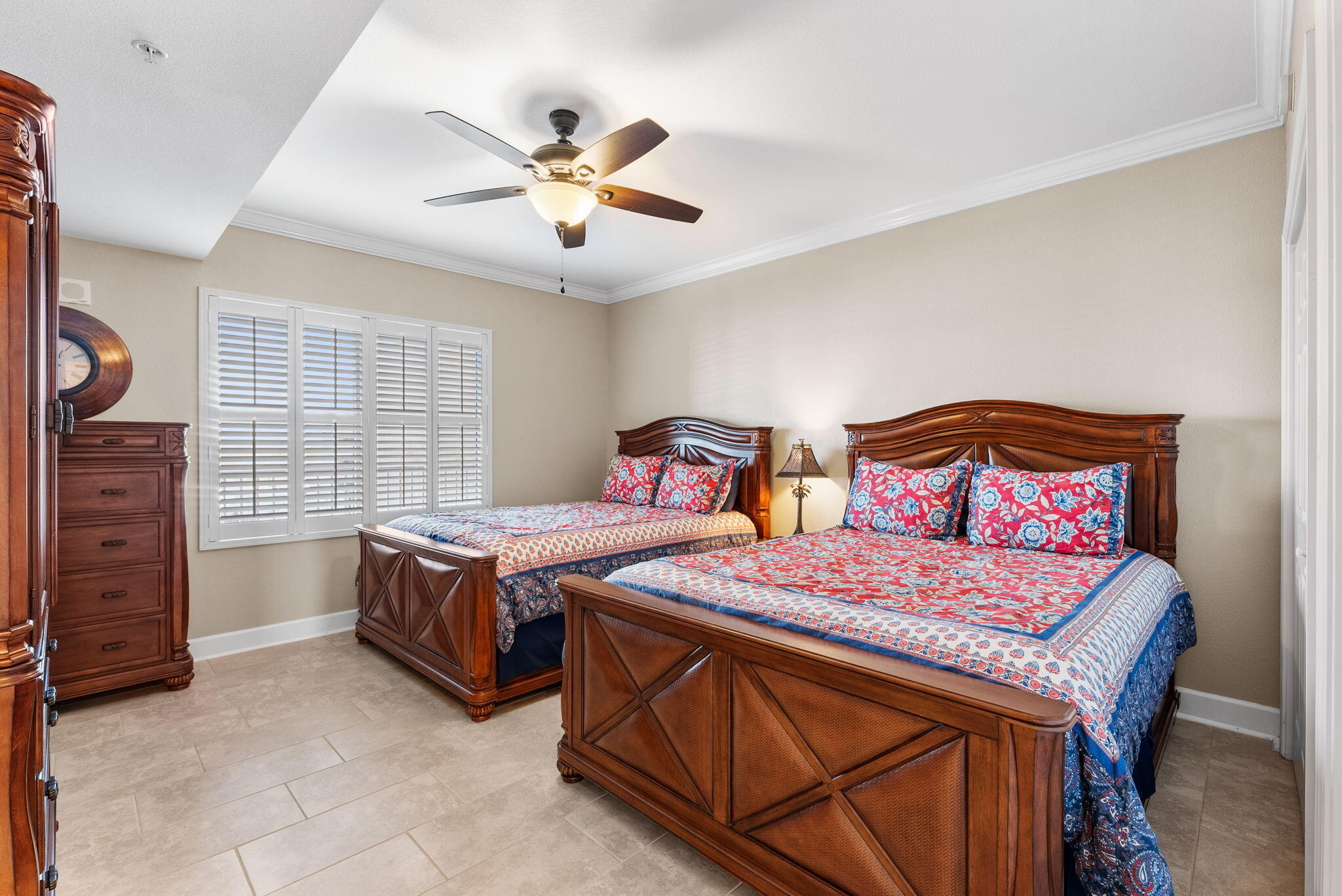 16819 Front Beach Road, Unit 405 Panama City Beach, FL 32413 - Photo 22 of 48 a bedroom with a bed and a chandelier