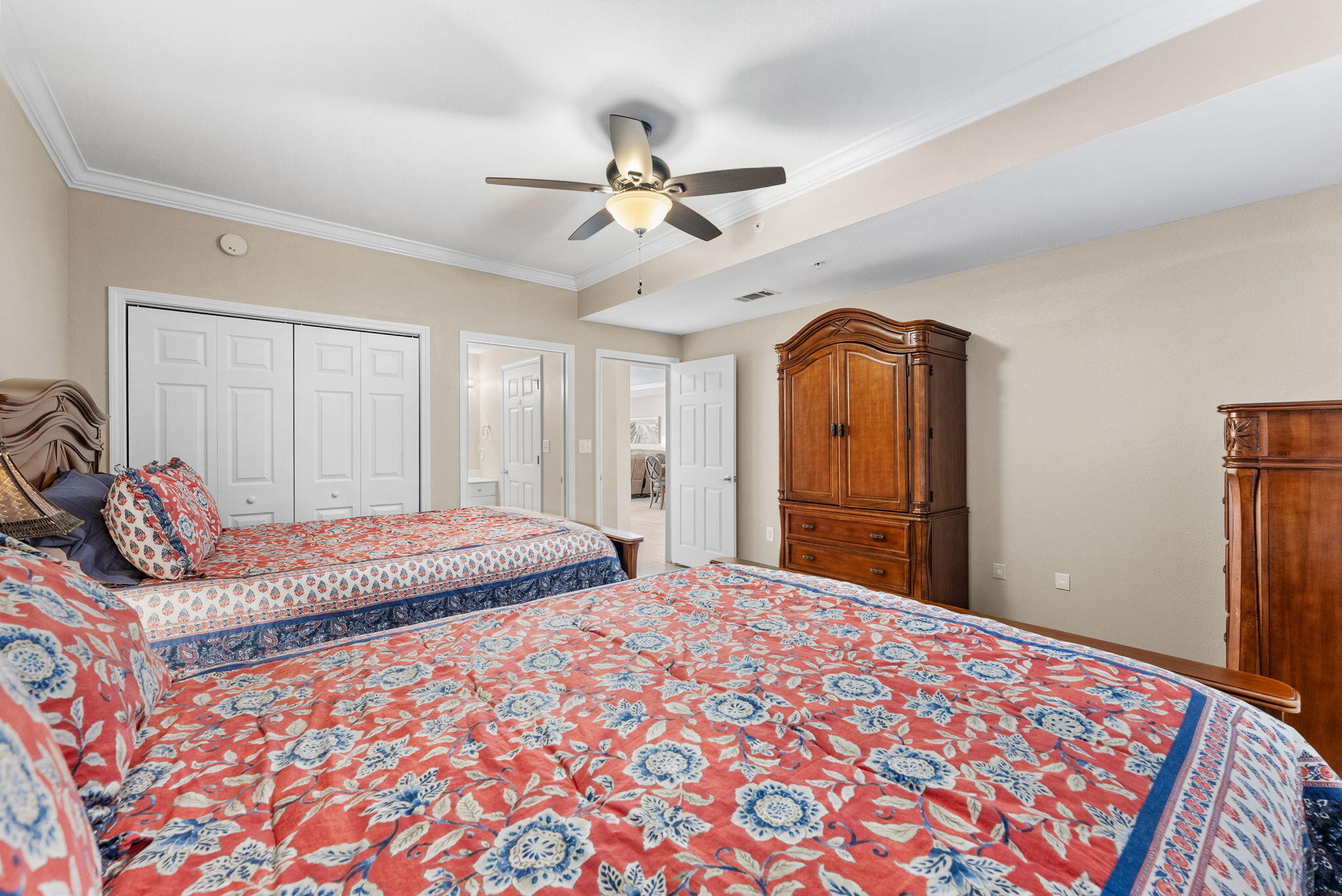 16819 Front Beach Road, Unit 405 Panama City Beach, FL 32413 - Photo 23 of 48 a bedroom with a bed and a dresser